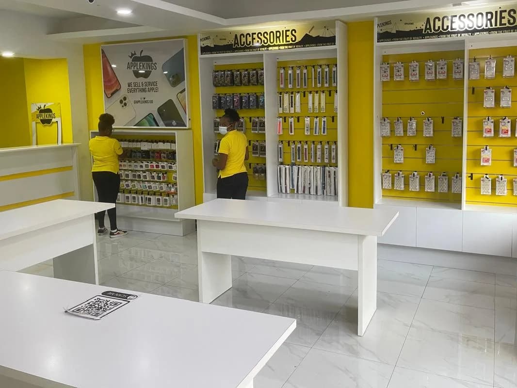 Applekings Ocho Rios store, with yellow-shirt staff, accessory walls and Applekings poster